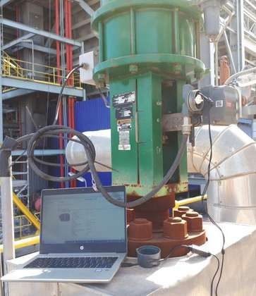 Control valve connected to a computerized testing setup after repair