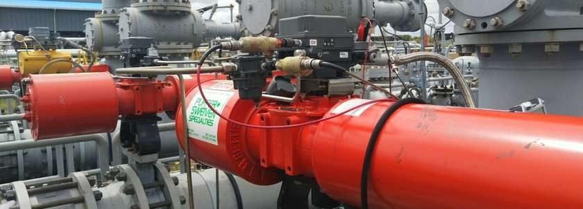 Large red ESD valve assembly in a pipeline undergoing partial stroke testing