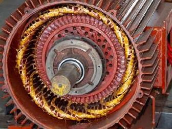 Copper stator windings of an industrial electric motor during rewinding